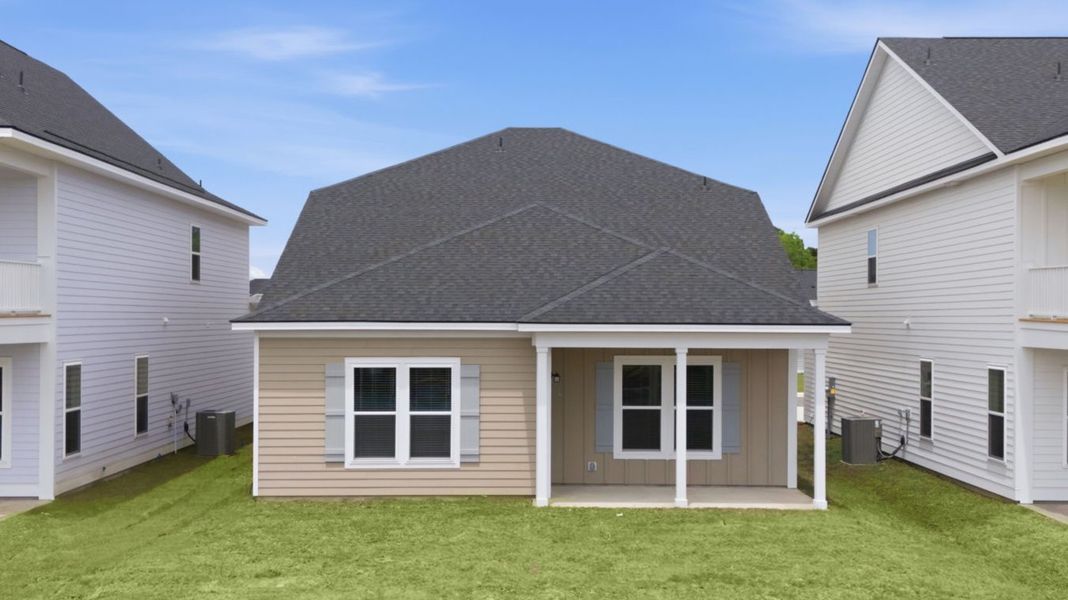 Exterior details and patio area of a home in Blue Heron Retreat, Little River (Image 4).