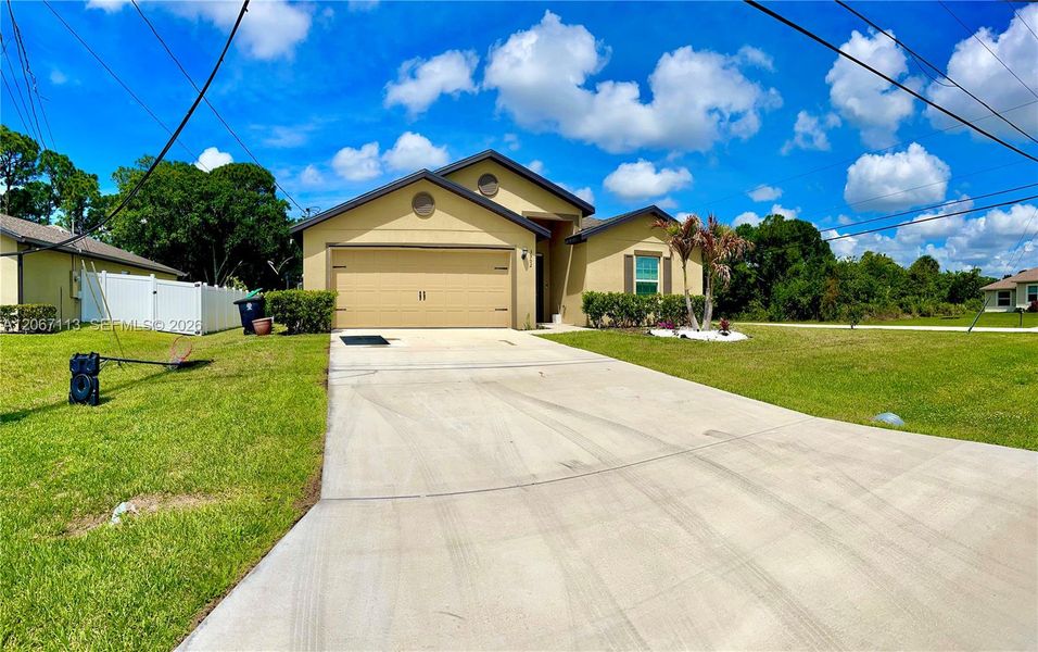 Front exterior of a new home in , Port St. Lucie, FL, highlighting curb appeal (Image 19). Front exterior of a new home in , Port St. Lucie, FL, highlighting curb appeal (Image 19).