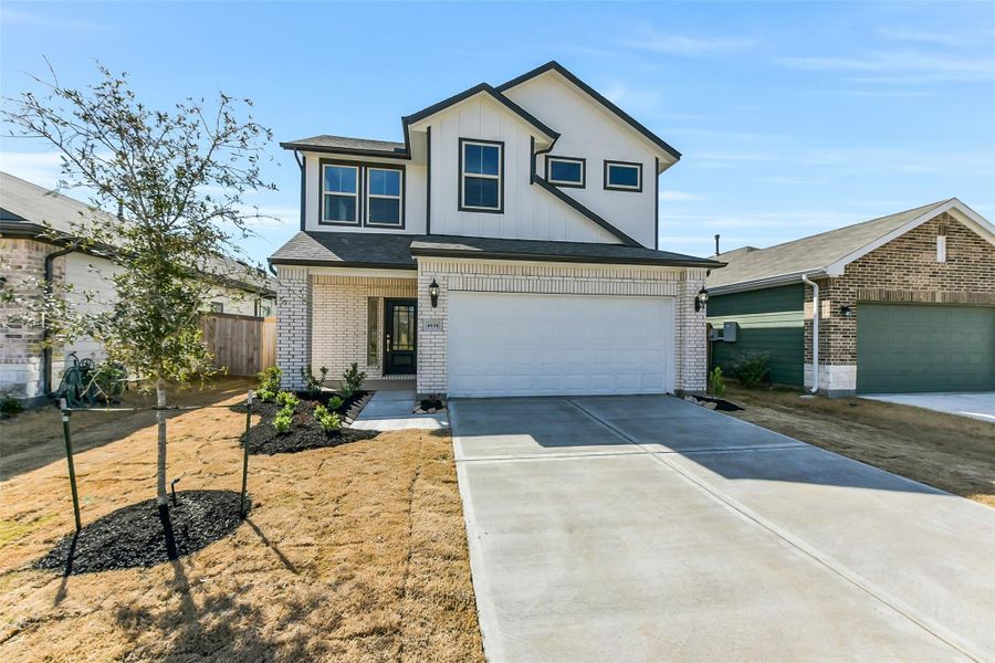 Front exterior of a new home in Colony at Pinehurst, Pinehurst, TX, highlighting curb appeal (Image 25). Front exterior of a new home in Colony at Pinehurst, Pinehurst, TX, highlighting curb appeal (Image 25).