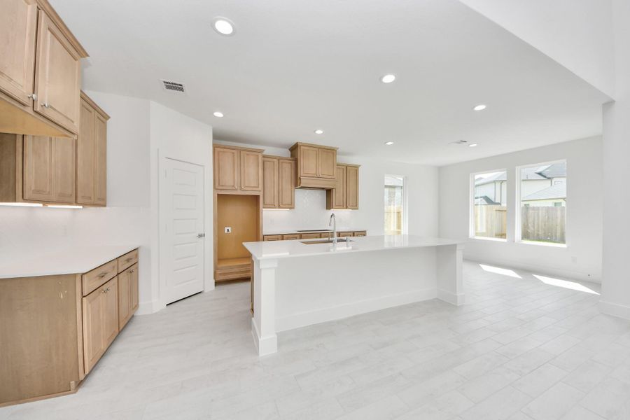 This kitchen is by far any chef’s dream! This spacious kitchen features high ceilings, light stained wood cabinets, granite countertop, SS appliances, modern tile backsplash, recessed lighting, extended counter space, granite kitchen island, and space for breakfast bar, and a walk-in pantry all overlooking your huge family room. This kitchen is by far any chef’s dream! This spacious kitchen features high ceilings, light stained wood cabinets, granite countertop, SS appliances, modern tile backsplash, recessed lighting, extended counter space, granite kitchen island, and space for breakfast bar, and a walk-in pantry all overlooking your huge family room.