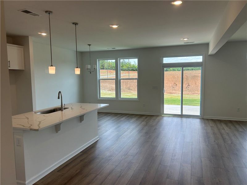 A welcoming interior offers a sleek kitchen island