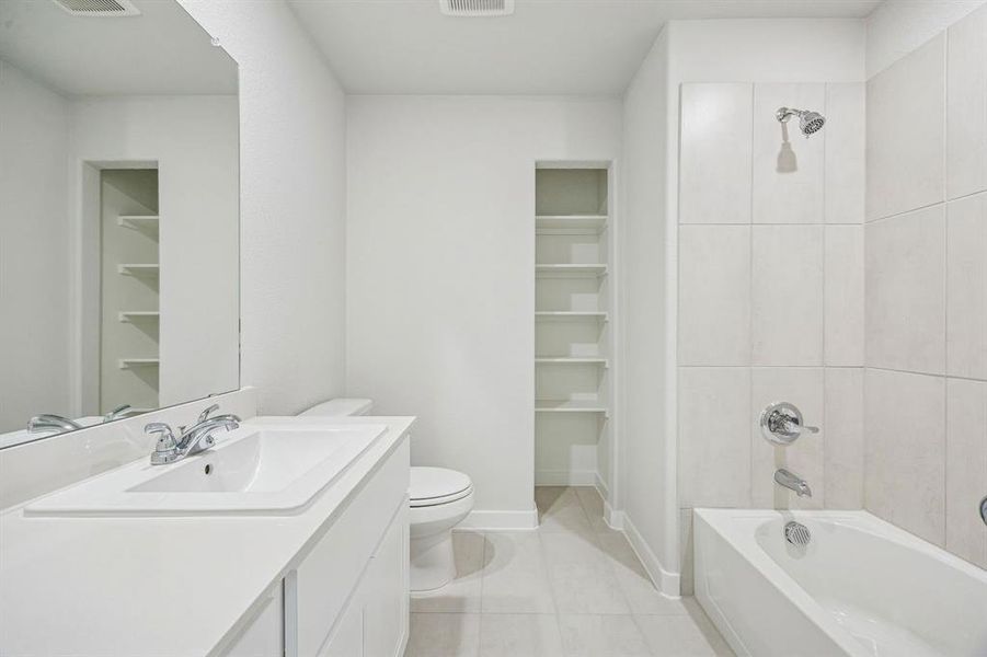 Bathroom in the Stanley II home plan by Trophy Signature Homes – REPRESENTATIVE PHOTO