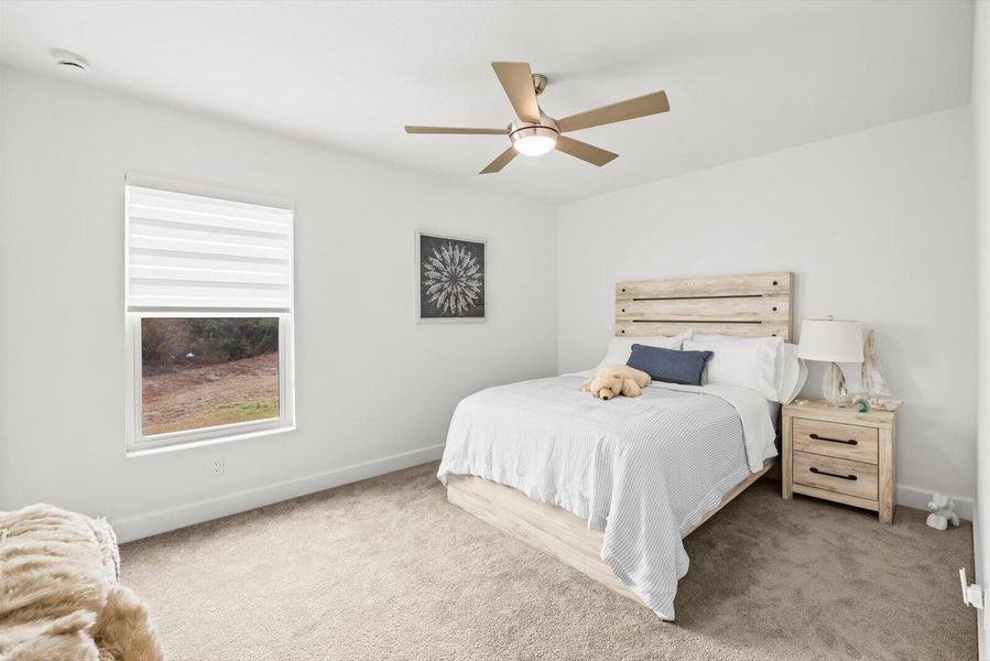 Private Fourth Bedroom Featuring a Walk-In Closet and Peaceful Window View