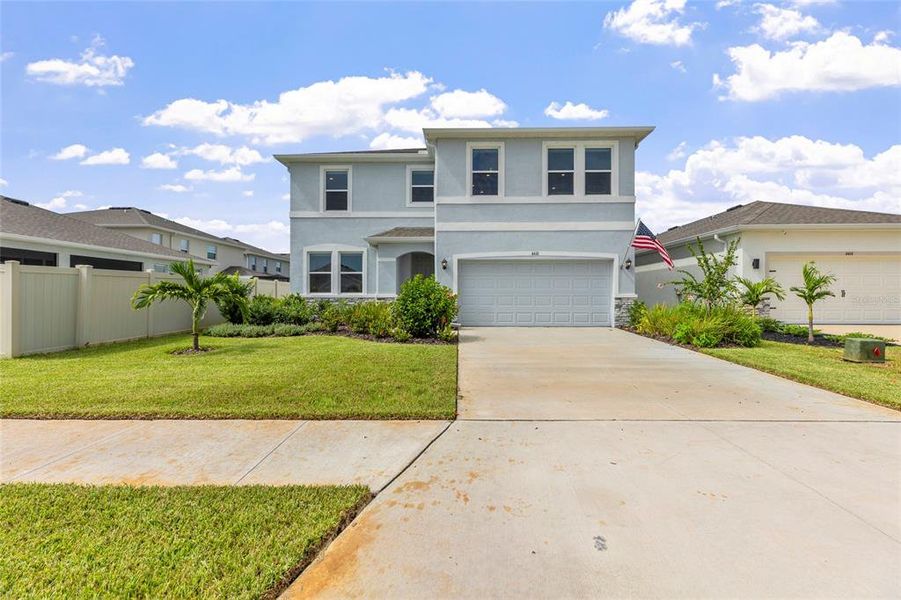 Front exterior of a new home in Silverstone North, Palmetto, FL, highlighting curb appeal (Image 25). Front exterior of a new home in Silverstone North, Palmetto, FL, highlighting curb appeal (Image 25).