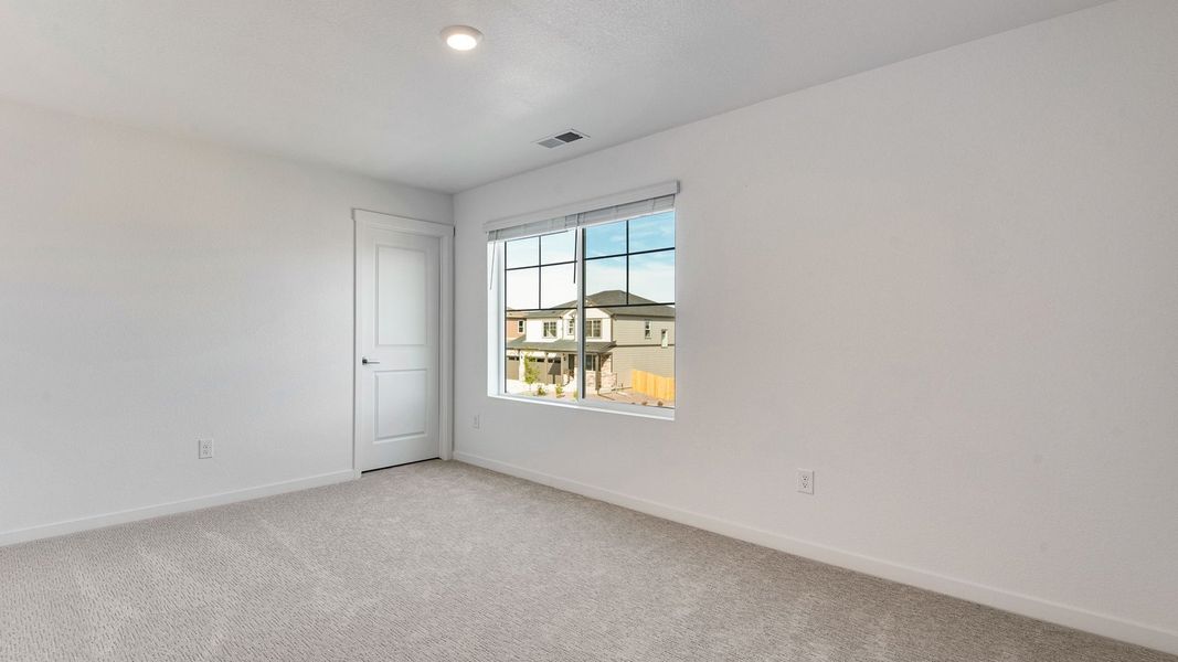 Spacious, unfurnished interior of a new home in Trails at Crowfoot, Parker (Image 24).