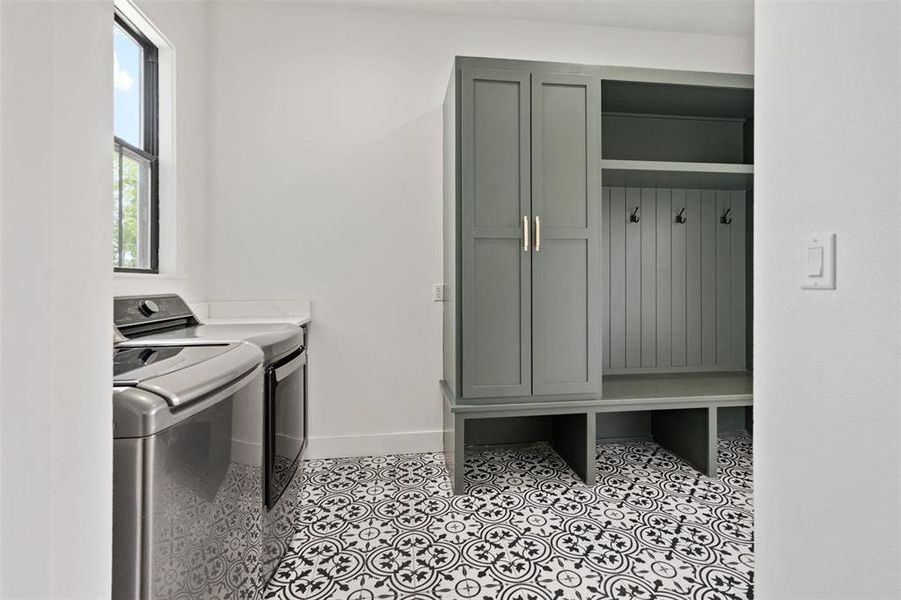Laundry room featuring cabinet space and washing machine and dryer