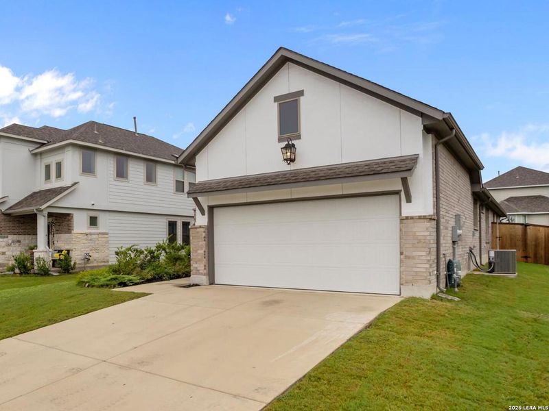 Front exterior of a new home in The Parklands, Schertz, TX, highlighting curb appeal (Image 18). Front exterior of a new home in The Parklands, Schertz, TX, highlighting curb appeal (Image 18).