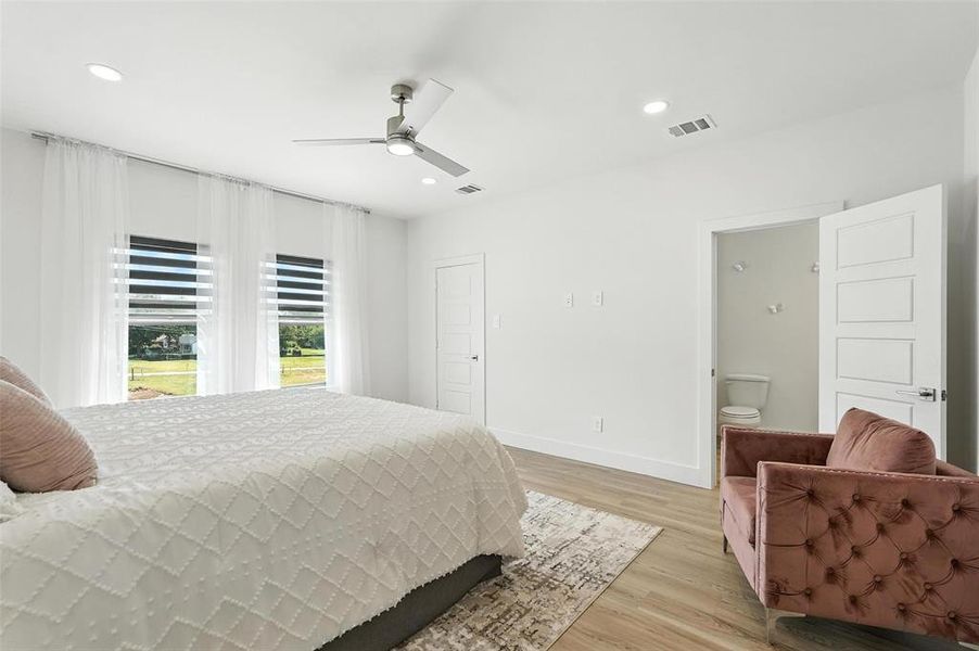 Bedroom featuring light wood-style flooring, recessed lighting, and ceiling fan