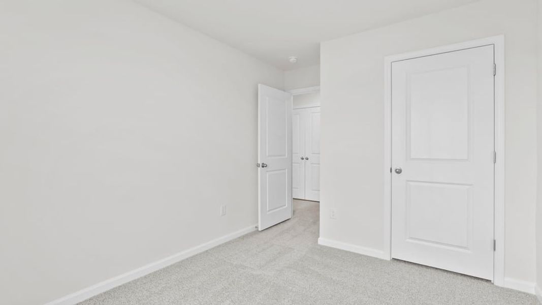 Spacious, unfurnished interior of a new home in Covington Village, Greer (Image 28).