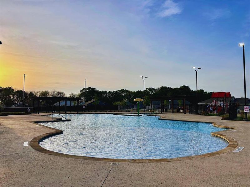 Community pool featuring a patio area
