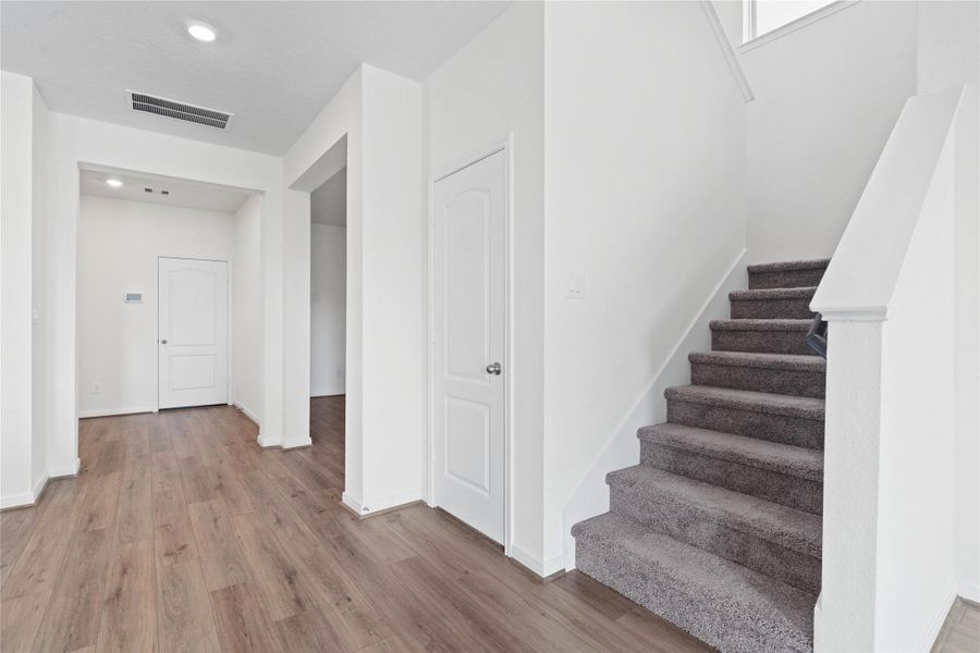 Step inside your new home, where the Layton Lake vinyl plank flooring and fresh, bright paint create a spacious, warm and inviting entryway. Step inside your new home, where the Layton Lake vinyl plank flooring and fresh, bright paint create a spacious, warm and inviting entryway.
