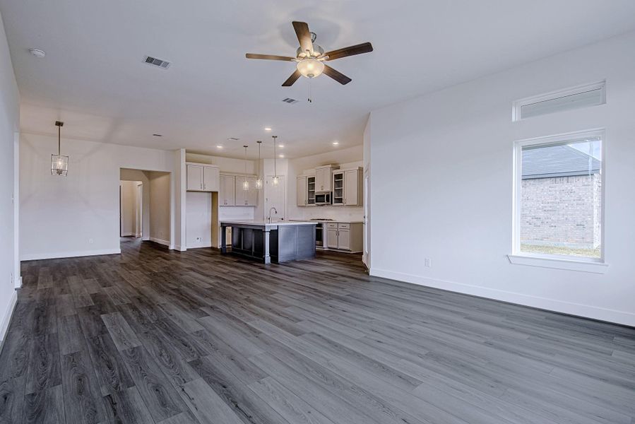 Spacious central living area serving as the focal point of the home's design Spacious central living area serving as the focal point of the home's design