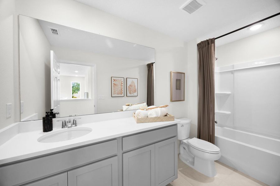 Representative furnished interior of a home built from the Finn by Risewell Homes in Eagletail Landings, Howey-in-the-Hills (Image 11).
