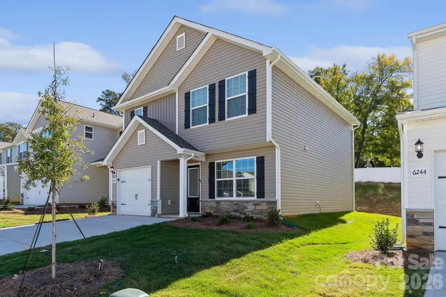 Front exterior of a new home in Creedmore Hills, Charlotte, NC, highlighting curb appeal (Image 17). Front exterior of a new home in Creedmore Hills, Charlotte, NC, highlighting curb appeal (Image 17).