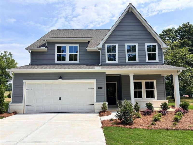 Front exterior of a new home in , Cumming, GA, highlighting curb appeal (Image 1). Front exterior of a new home in , Cumming, GA, highlighting curb appeal (Image 1).