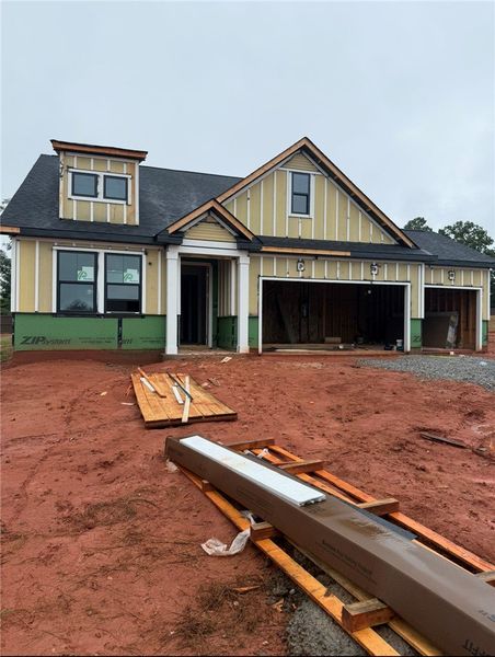 A newly constructed residence features an attached A newly constructed residence features an attached