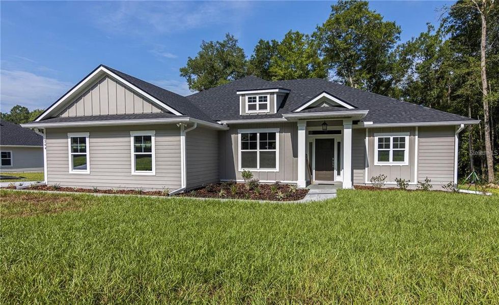Front exterior of a new home in , Lake City, FL, highlighting curb appeal (Image 1). Front exterior of a new home in , Lake City, FL, highlighting curb appeal (Image 1).