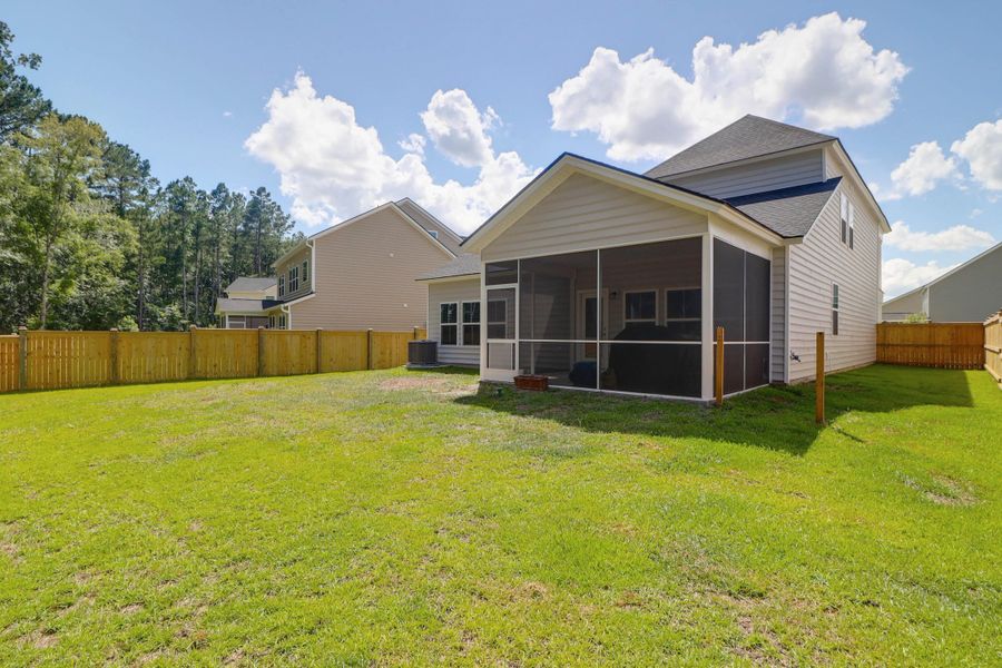 Exterior details and patio area of a home in Sweetgrass at Summers Corner: Arbor Collection, Summerville (Image 29).