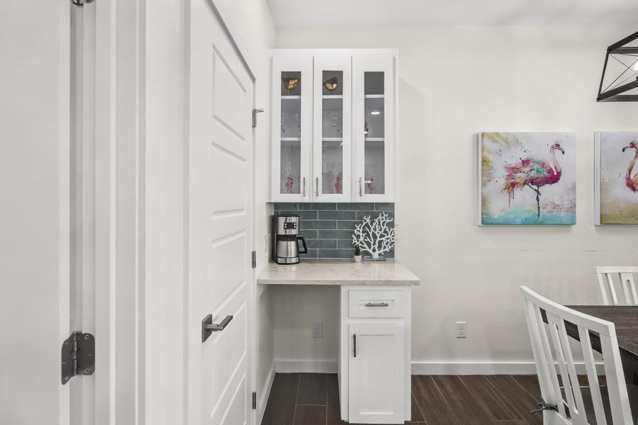 Home office featuring wood finish floors and baseboards Home office featuring wood finish floors and baseboards