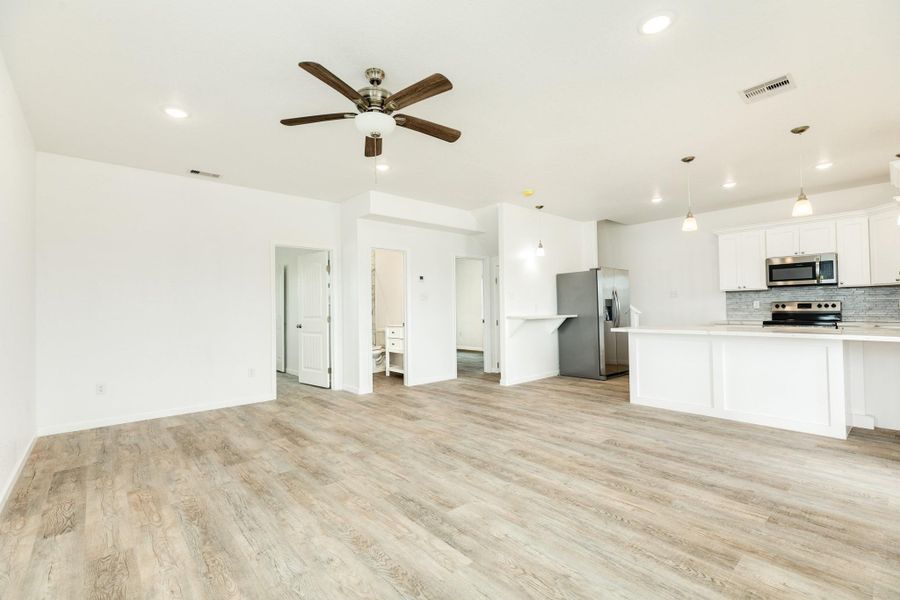 Two bedrooms and a bathromm are off the living area