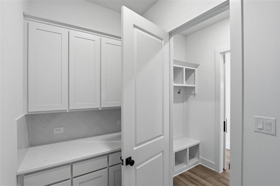 Mudroom featuring light wood-style flooring