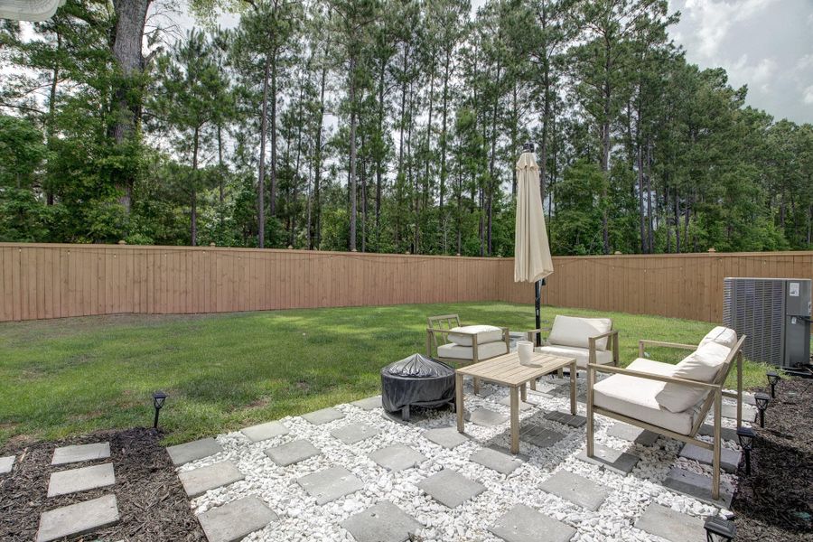 Exterior details and patio area of a home in Oakley Pointe, Moncks Corner (Image 31). Exterior details and patio area of a home in Oakley Pointe, Moncks Corner (Image 31).