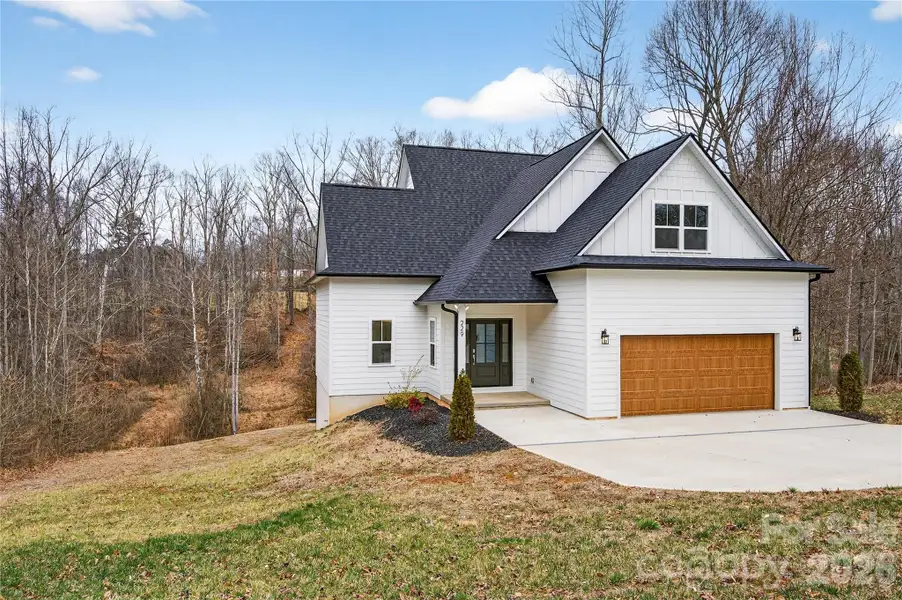 Front exterior of a new home in , Troutman, NC, highlighting curb appeal (Image 1). Front exterior of a new home in , Troutman, NC, highlighting curb appeal (Image 1).