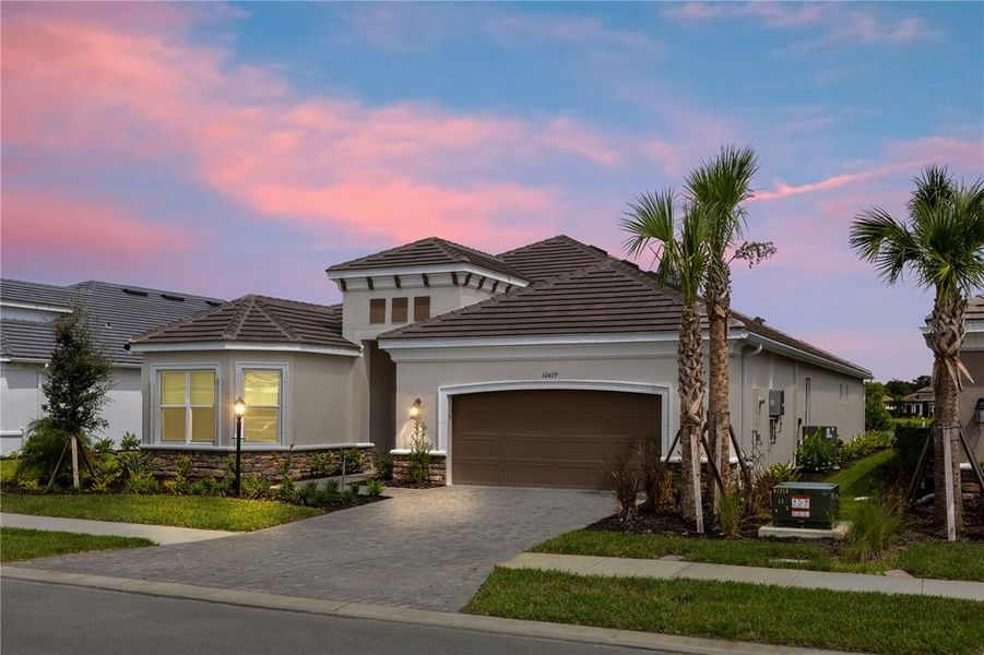 Front exterior of a new home in , Sarasota, FL, highlighting curb appeal (Image 1).