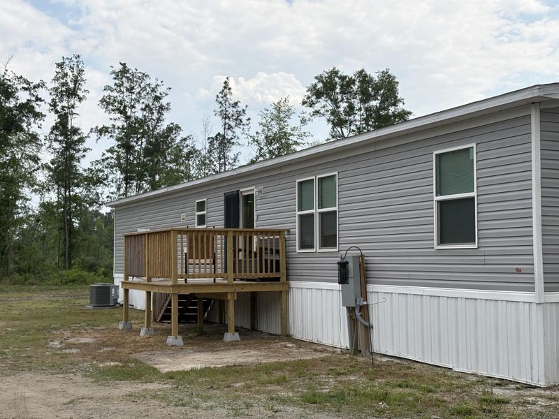 Exterior details and patio area of a home in , Cottageville (Image 23).