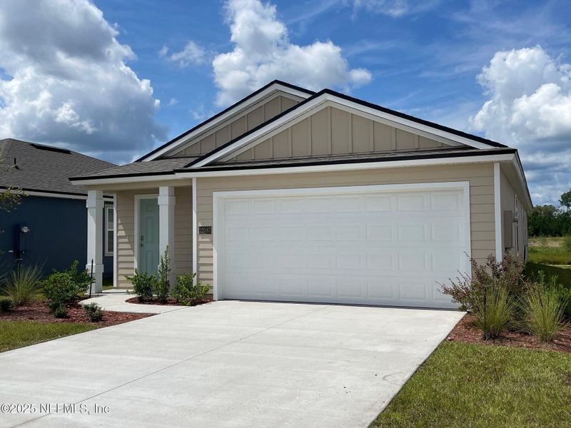 Front exterior of a new home in The Arbors, Jacksonville, FL, highlighting curb appeal (Image 17).