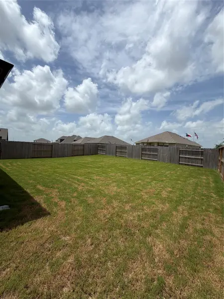 Exterior details and patio area of a home in Creekhaven, Iowa Colony (Image 2). Exterior details and patio area of a home in Creekhaven, Iowa Colony (Image 2).