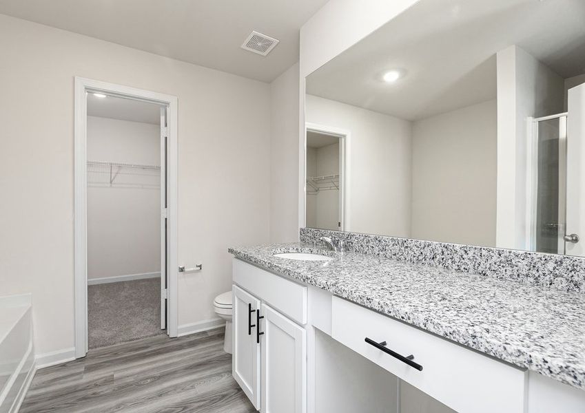 Get ready for your day in the master bathroom