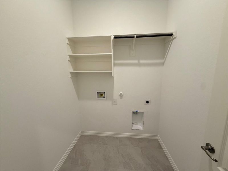 Laundry area with gas dryer hookup, hookup for an electric dryer, and hookup for a washing machine Laundry area with gas dryer hookup, hookup for an electric dryer, and hookup for a washing machine