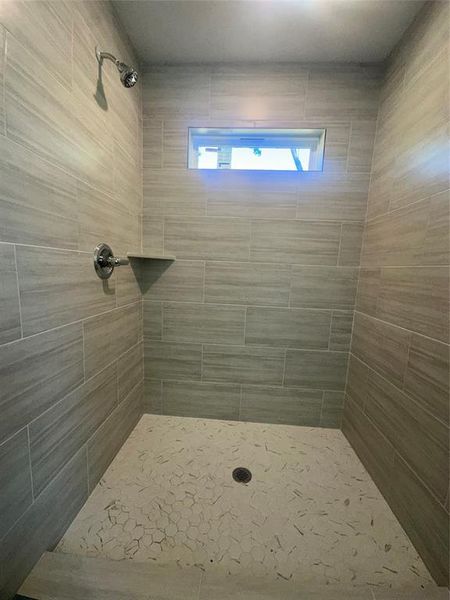 Bathroom with tiled shower