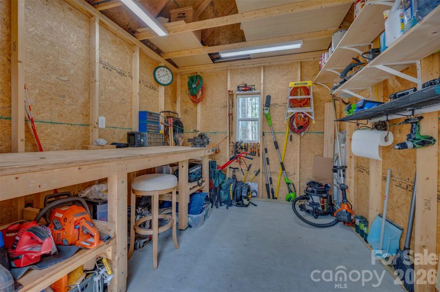 Workbench, metal pegboard and compressor does not convey. Workbench, metal pegboard and compressor does not convey.