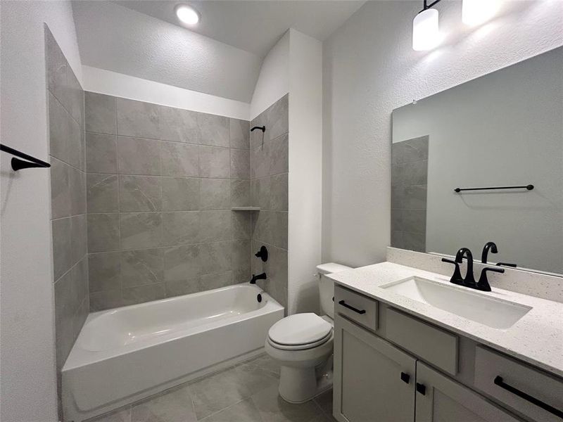 The secondary bathroom on the second floor is conveniently located for easy access from the bedrooms.