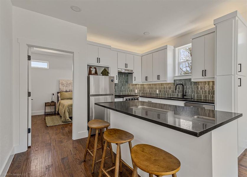 Quartz countertops in kitchen with full amenities