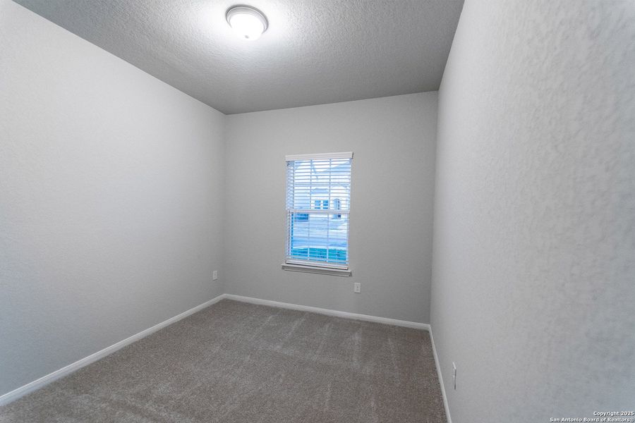 Spacious, unfurnished interior of a new home in Hennersby Hollow, San Antonio (Image 14).