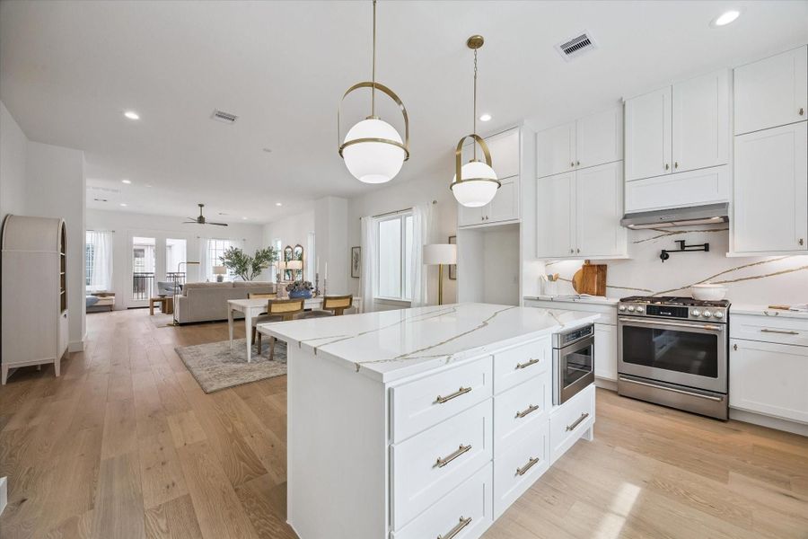 Stunning kitchen and open-concept living spaces.