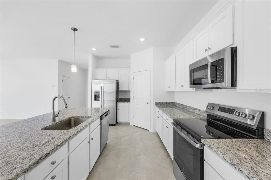 Furnished interior view inside a new home in Hampton Lakes at River Hall, Alva (Image 9).