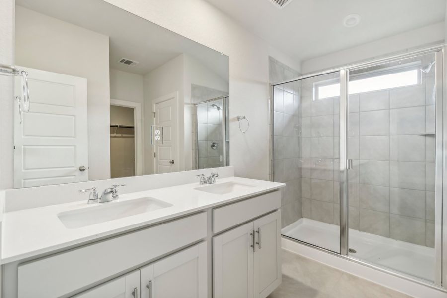 Primary suite bathroom in the Hughes floorplan at a Meritage Homes community.