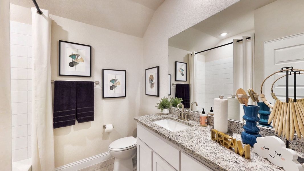 A bathroom with a large mirror. A bathroom with a large mirror.