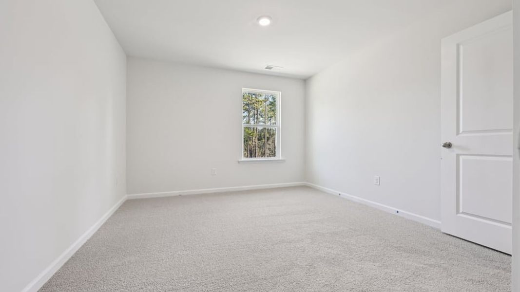 Spacious, unfurnished interior of a new home in Gretchen Pines, West End (Image 23).