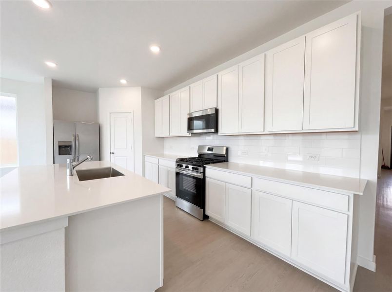 Furnished interior view inside a new home in Sunterra, Katy (Image 9).