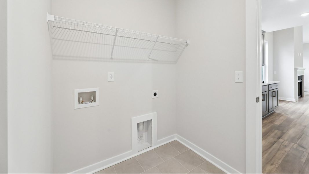 Dedicated Laundry Room with ventilated shelf