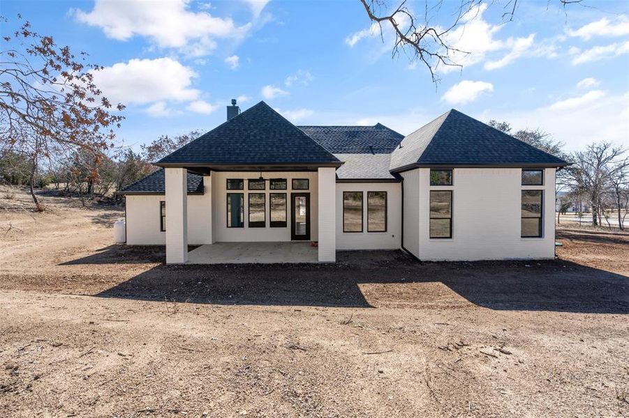 Rear view of property with a patio area