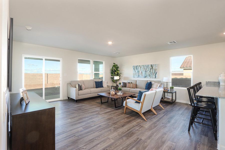 A living room with a wood floor. A living room with a wood floor.
