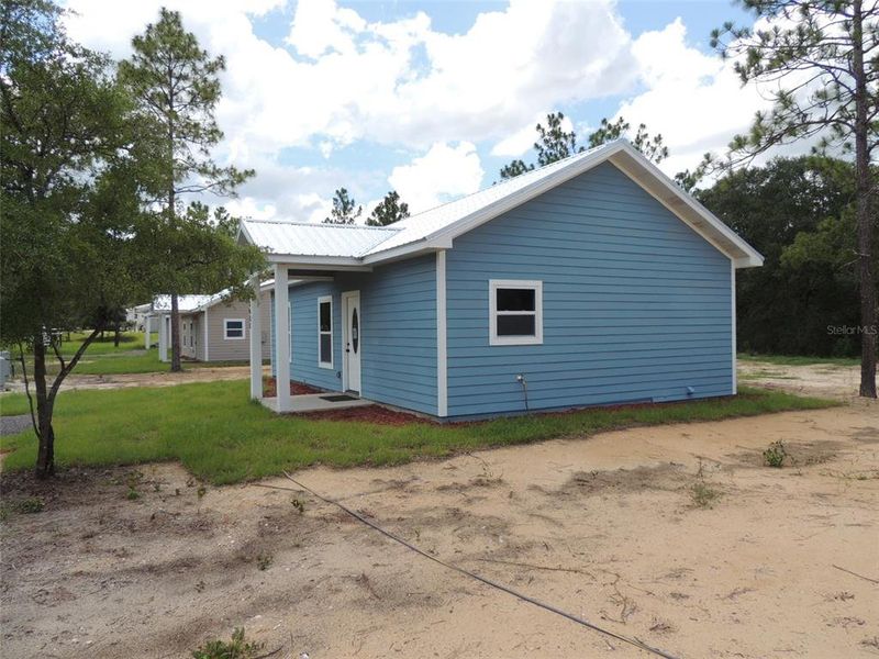 Exterior details and patio area of a home in , Williston (Image 3).