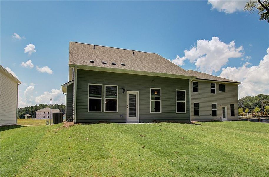 Front exterior of a new home in Enclave at Evergreen, Fairburn, GA, highlighting curb appeal (Image 2).
