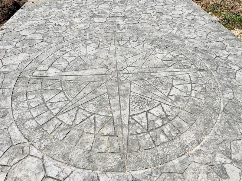 Stamped concrete Insignia detail on driveway